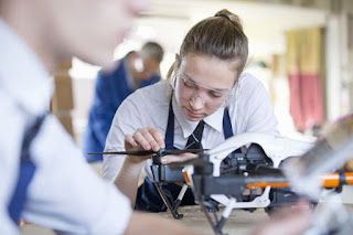 Students working on a drone